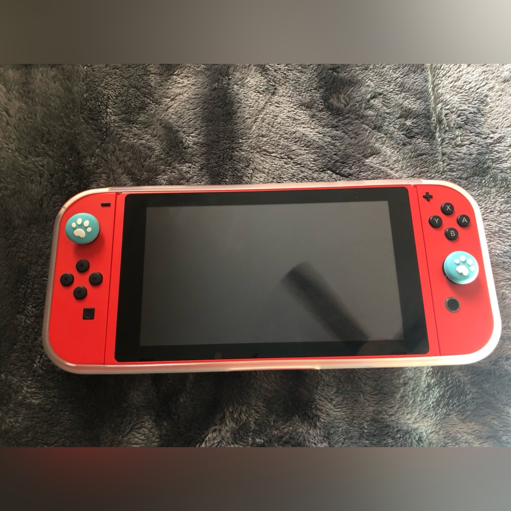 Gently used NINTENDO SWITCH (Mario edition) with clear case & customized D- pads